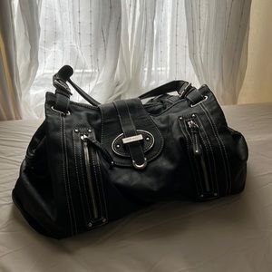 Nine West bag. Bought from thred up. Has a lot of space.